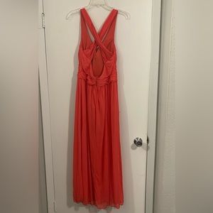 Coral crisscross back Prom dress from David’s Bridal.  Worn once